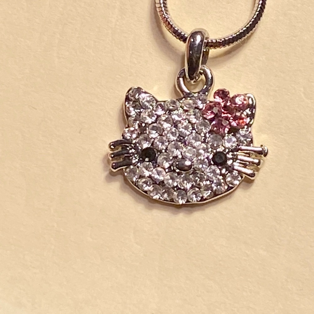 Sparkle kitty fun fashion pendant on 14” chain necklace.